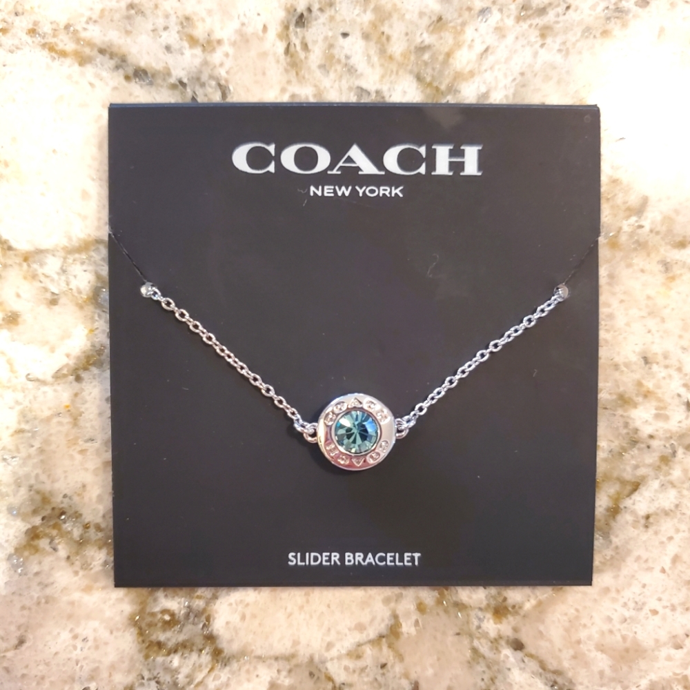Coach slider bracelet with blue stone